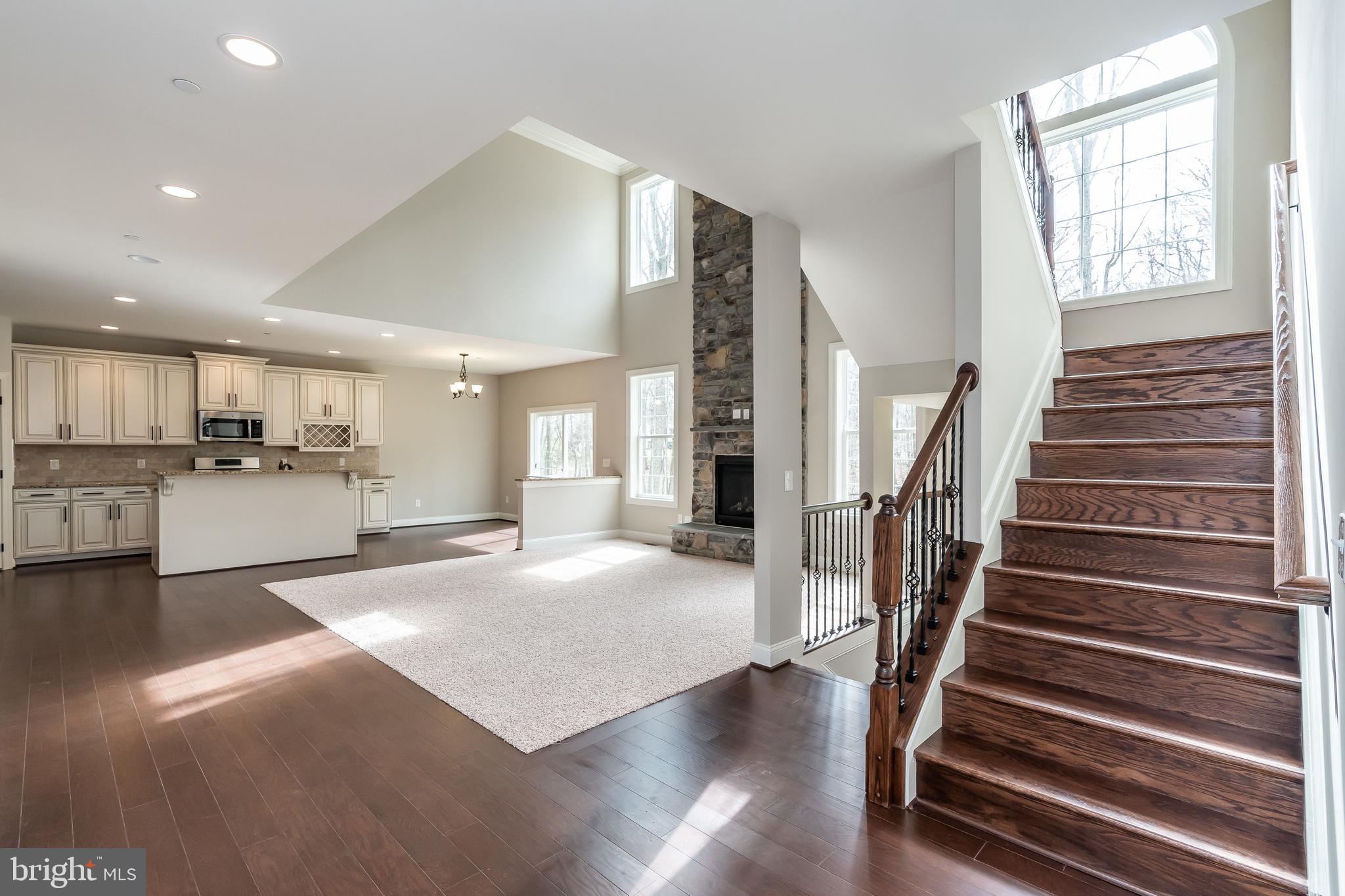 470 Queenstown Road Severn, MD 21144 - Photo 14 of 56 a view of an entryway with wooden floor and a kitchen