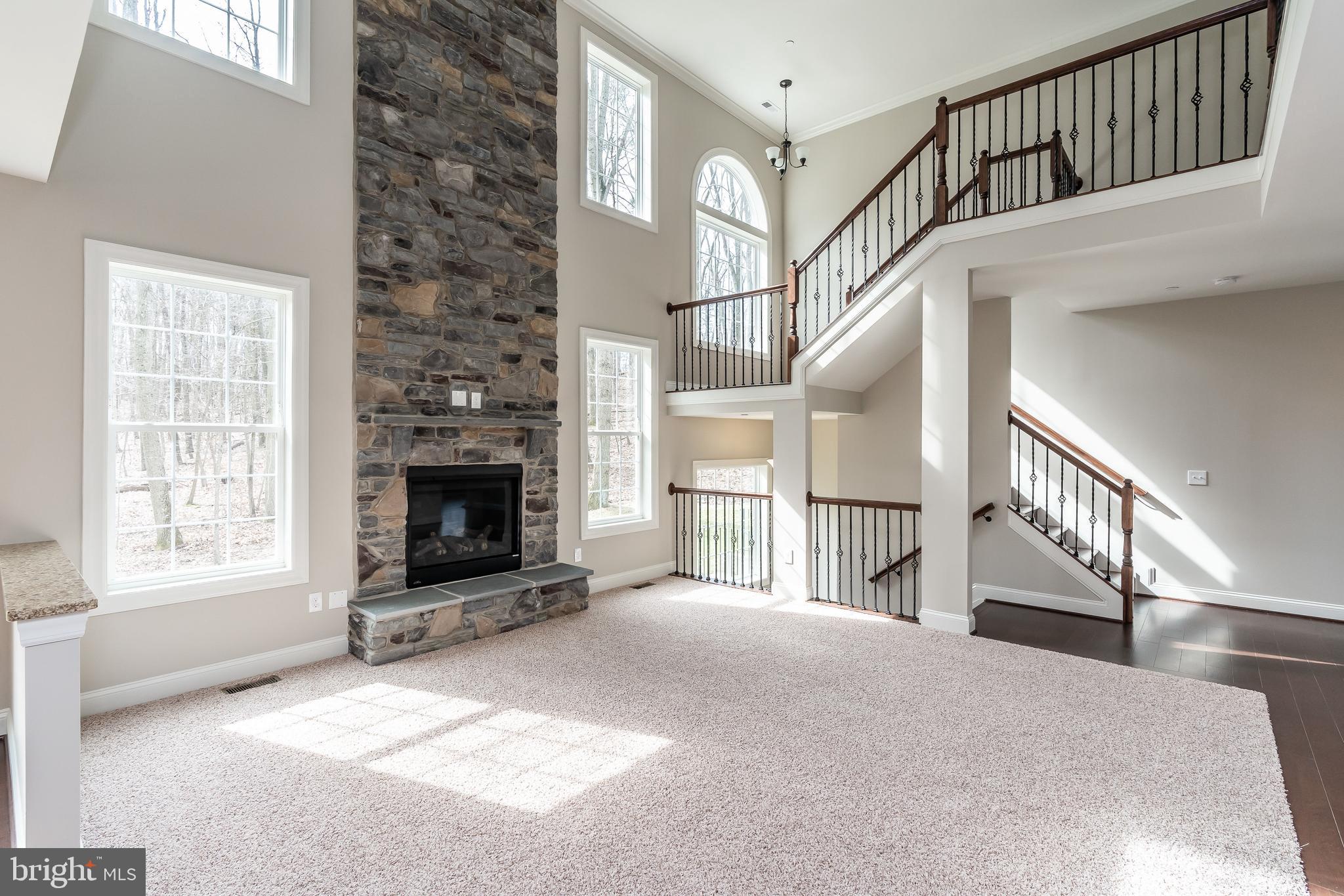 470 Queenstown Road Severn, MD 21144 - Photo 17 of 56 a view of a livingroom with an empty space and a fireplace
