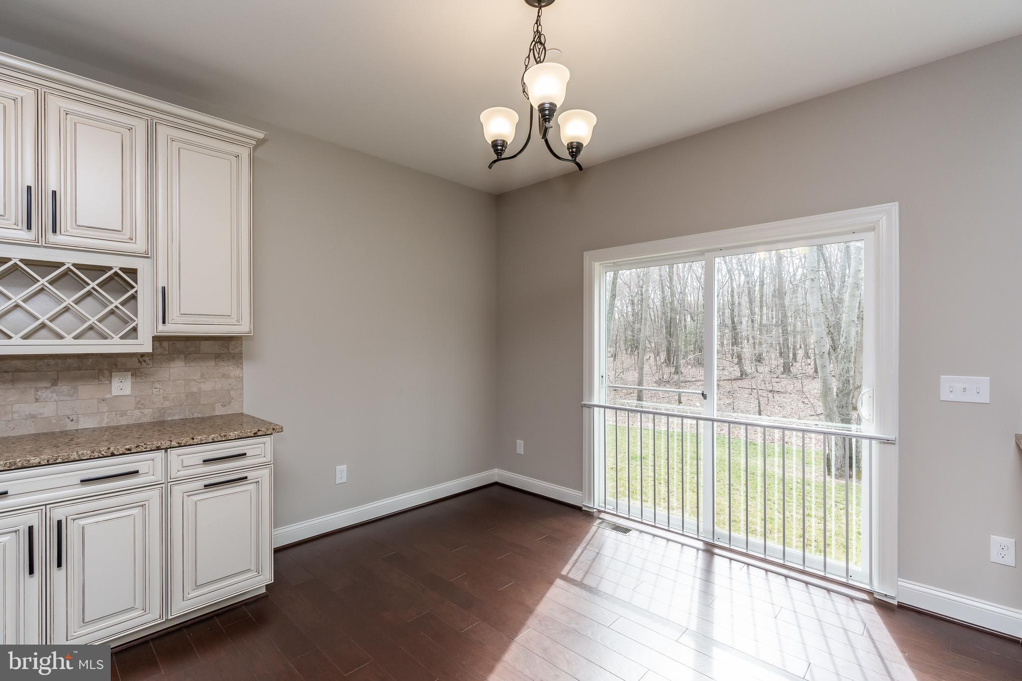 470 Queenstown Road Severn, MD 21144 - Photo 25 of 56 a view of a kitchen with an empty space and a window