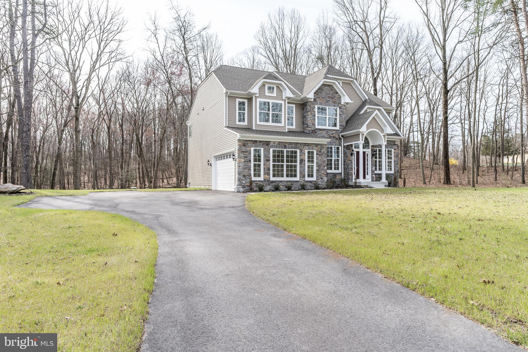 470 Queenstown Road Severn, MD 21144 - Photo 4 of 56 a front view of house with yard and trees around