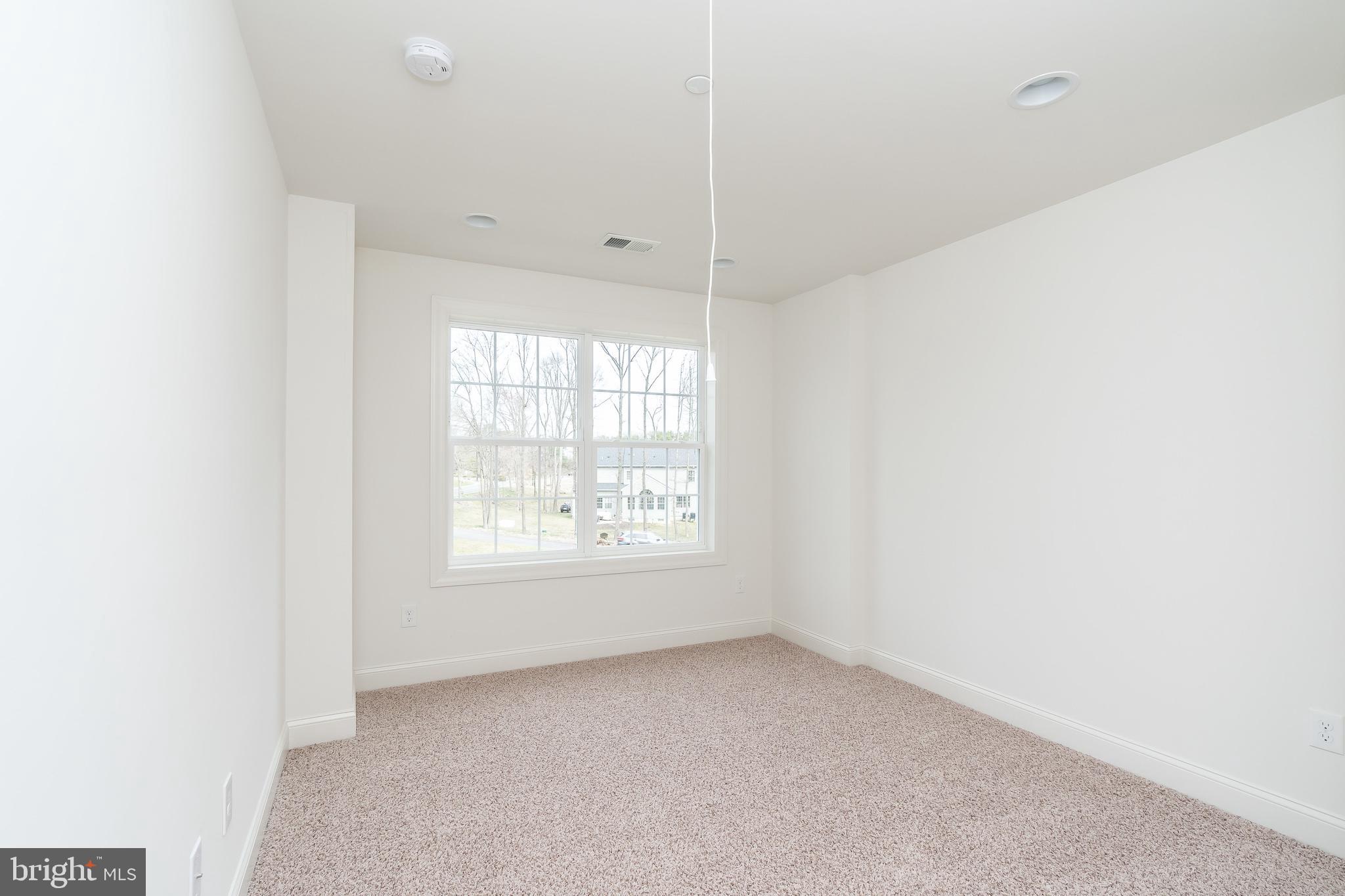 470 Queenstown Road Severn, MD 21144 - Photo 40 of 56 a view of an empty room with a window