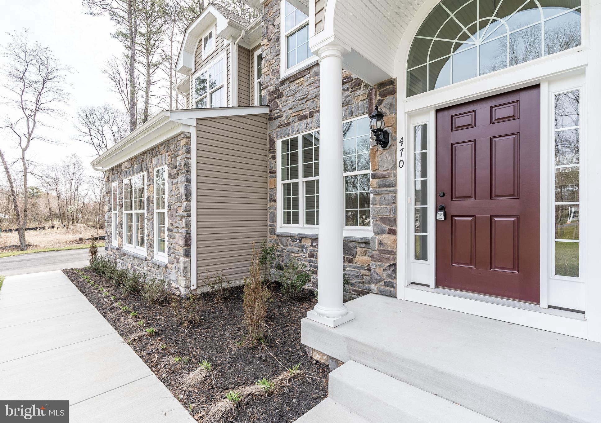 470 Queenstown Road Severn, MD 21144 - Photo 5 of 56 a front view of a house with a yard