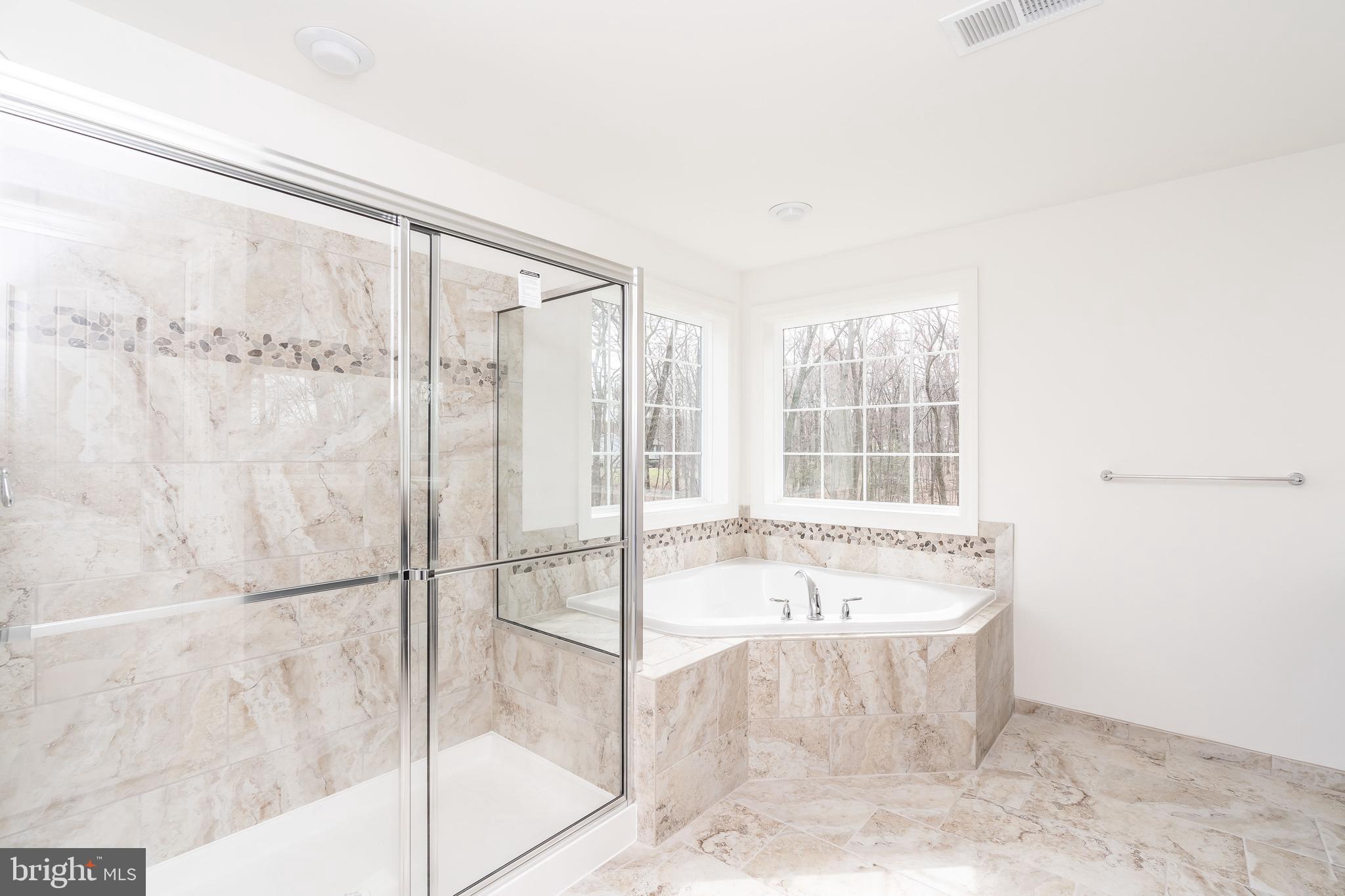 470 Queenstown Road Severn, MD 21144 - Photo 45 of 56 a bathroom with a bathtub and a shower