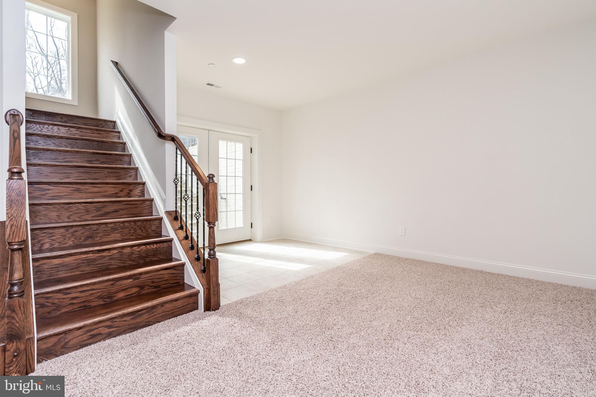470 Queenstown Road Severn, MD 21144 - Photo 50 of 56 a view of an empty room with stairs