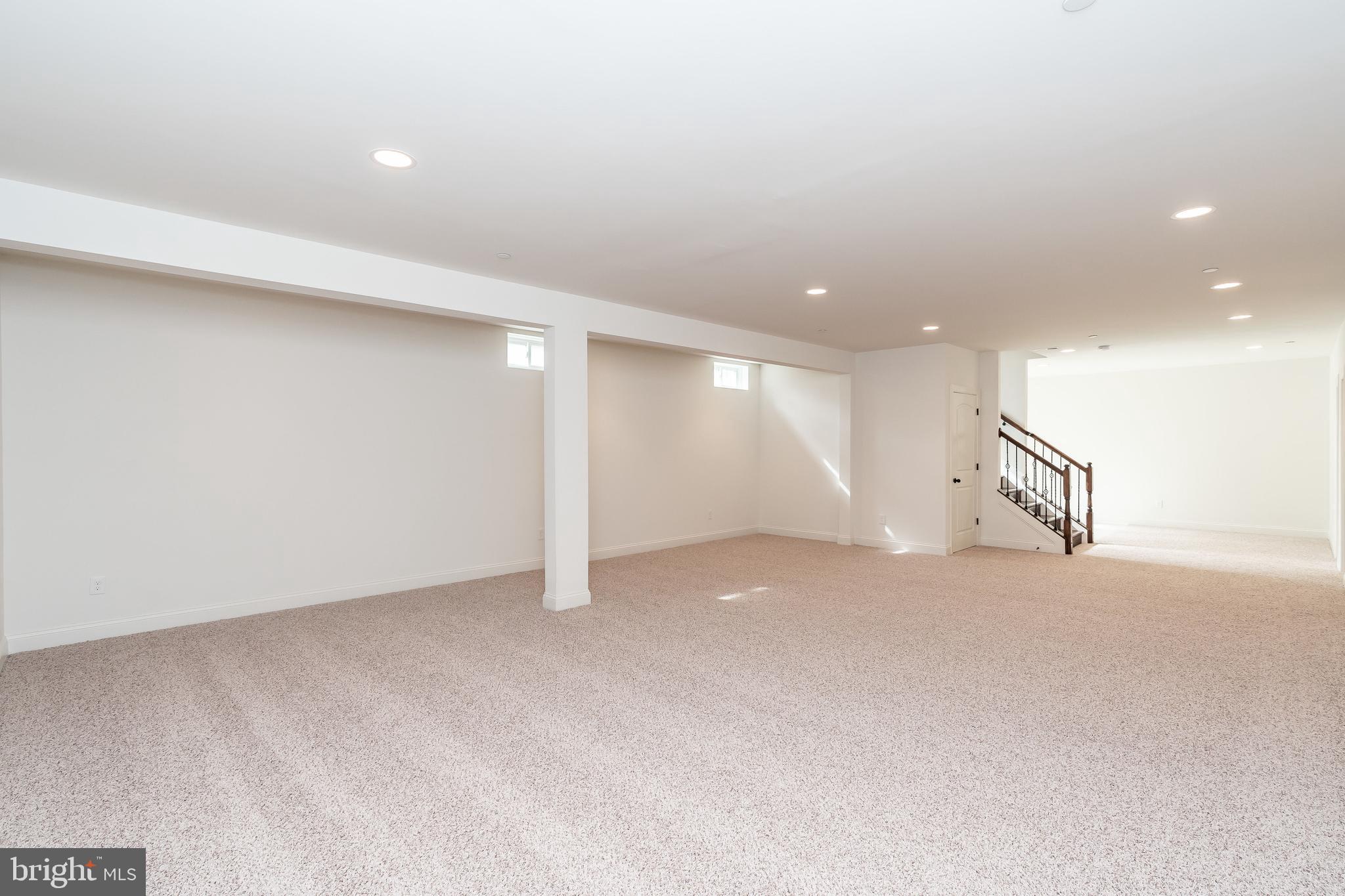 470 Queenstown Road Severn, MD 21144 - Photo 55 of 56 an empty room with a ceiling fan and window
