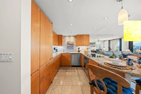 a kitchen with a sink cabinets and appliances