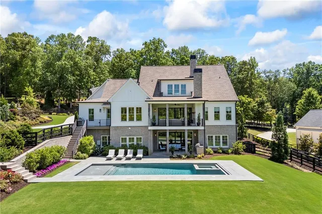 a front view of a house with a yard table and chairs