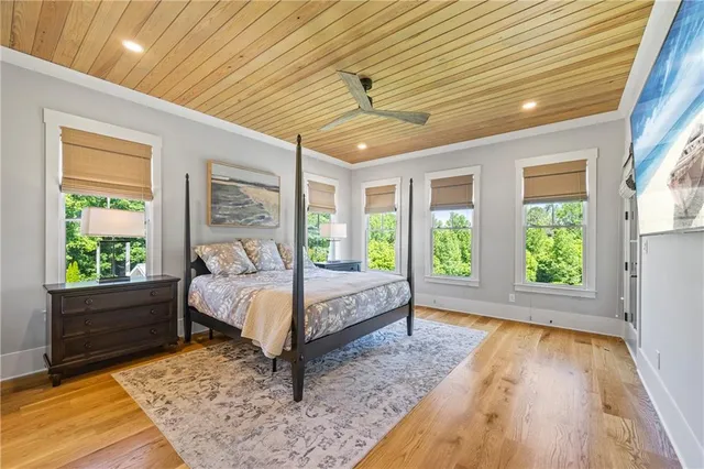 a bedroom with a large bed and a window