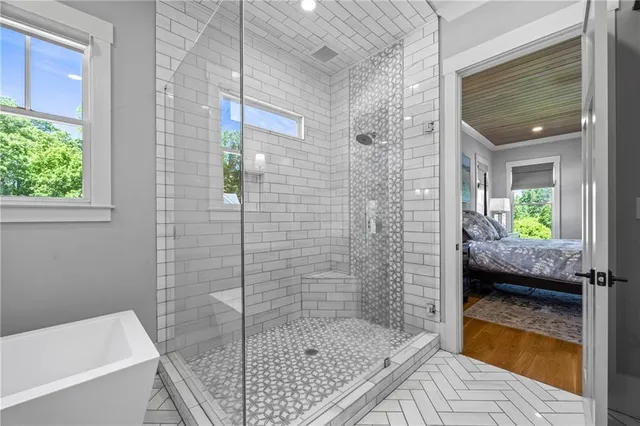 a bathroom with a toilet sink vanity and mirror