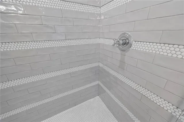 a living room with furniture a window and a flat screen tv