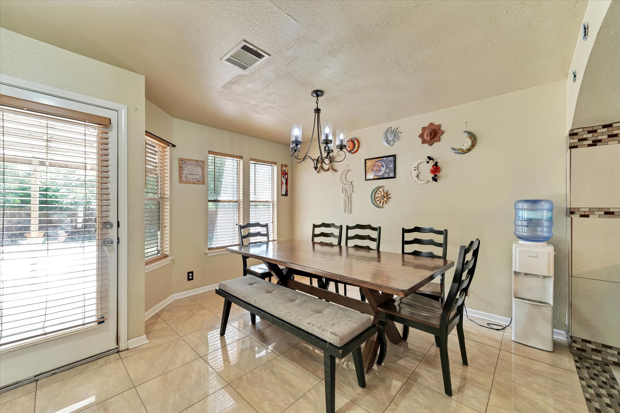 2601 Highcloud Drive Lockhart, TX 78644 - Photo 12 of 30 a view of a dining room with furniture and chandelier