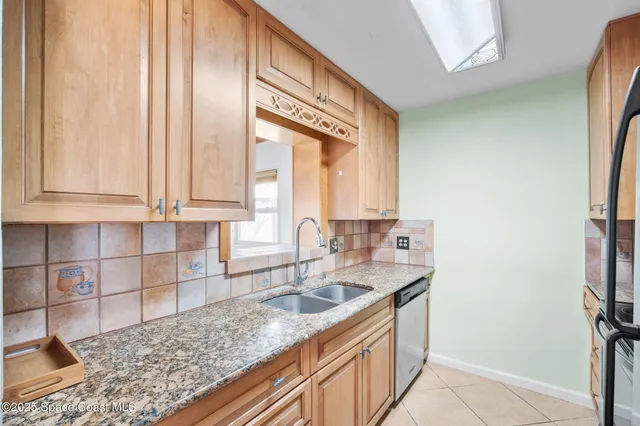 a kitchen with a sink and a window