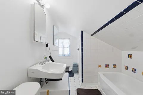 a view of room with cabinet and air conditioner vent