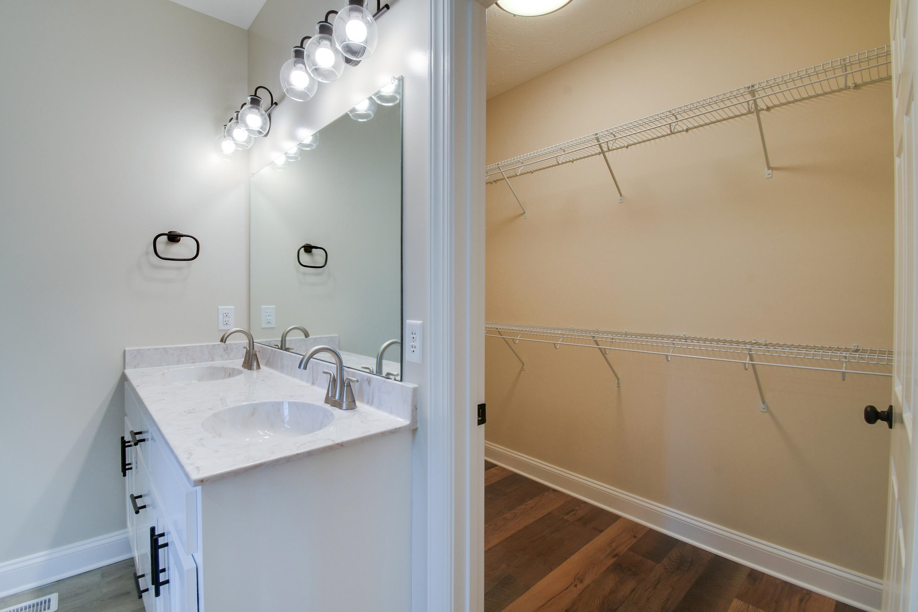 103 Fall Ridge Drive Stuarts Draft, VA 24477 - Photo 18 of 31 a bathroom with a sink and a mirror