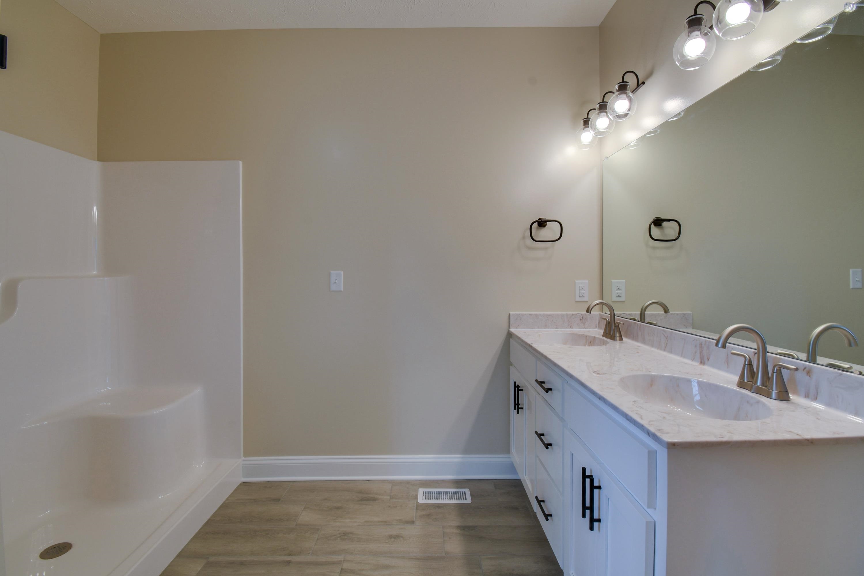 103 Fall Ridge Drive Stuarts Draft, VA 24477 - Photo 19 of 31 a bathroom with a double vanity sink and a mirror
