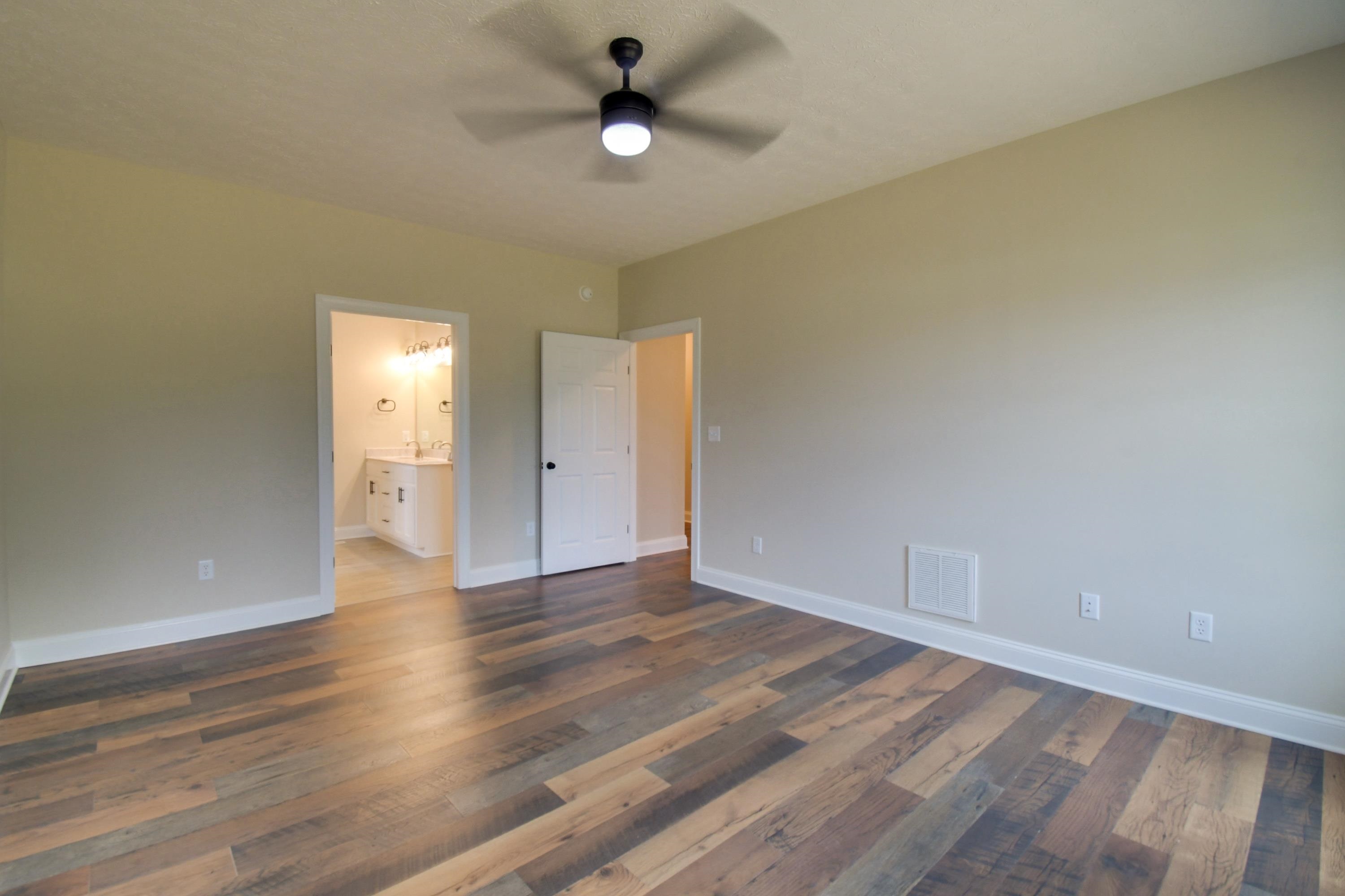 103 Fall Ridge Drive Stuarts Draft, VA 24477 - Photo 20 of 31 wooden floor in an empty room with a window