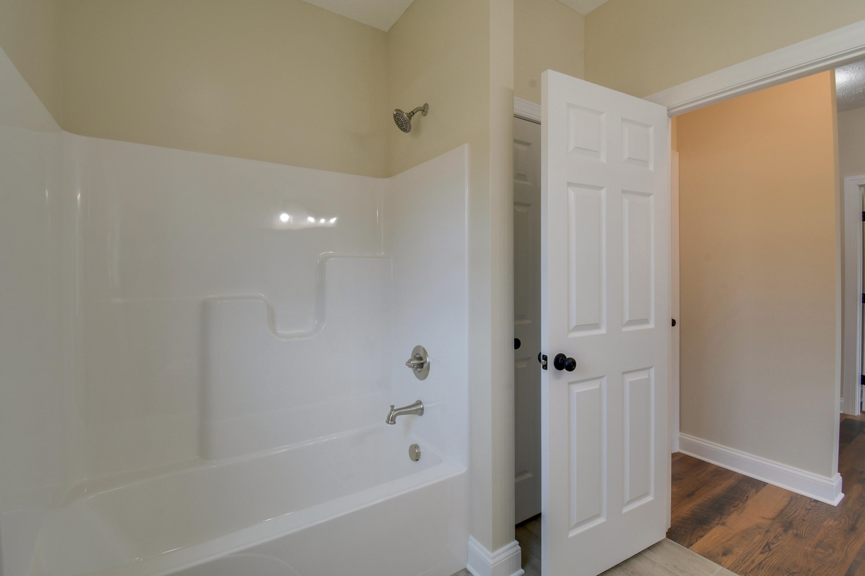 103 Fall Ridge Drive Stuarts Draft, VA 24477 - Photo 23 of 31 a bathroom with a bathtub