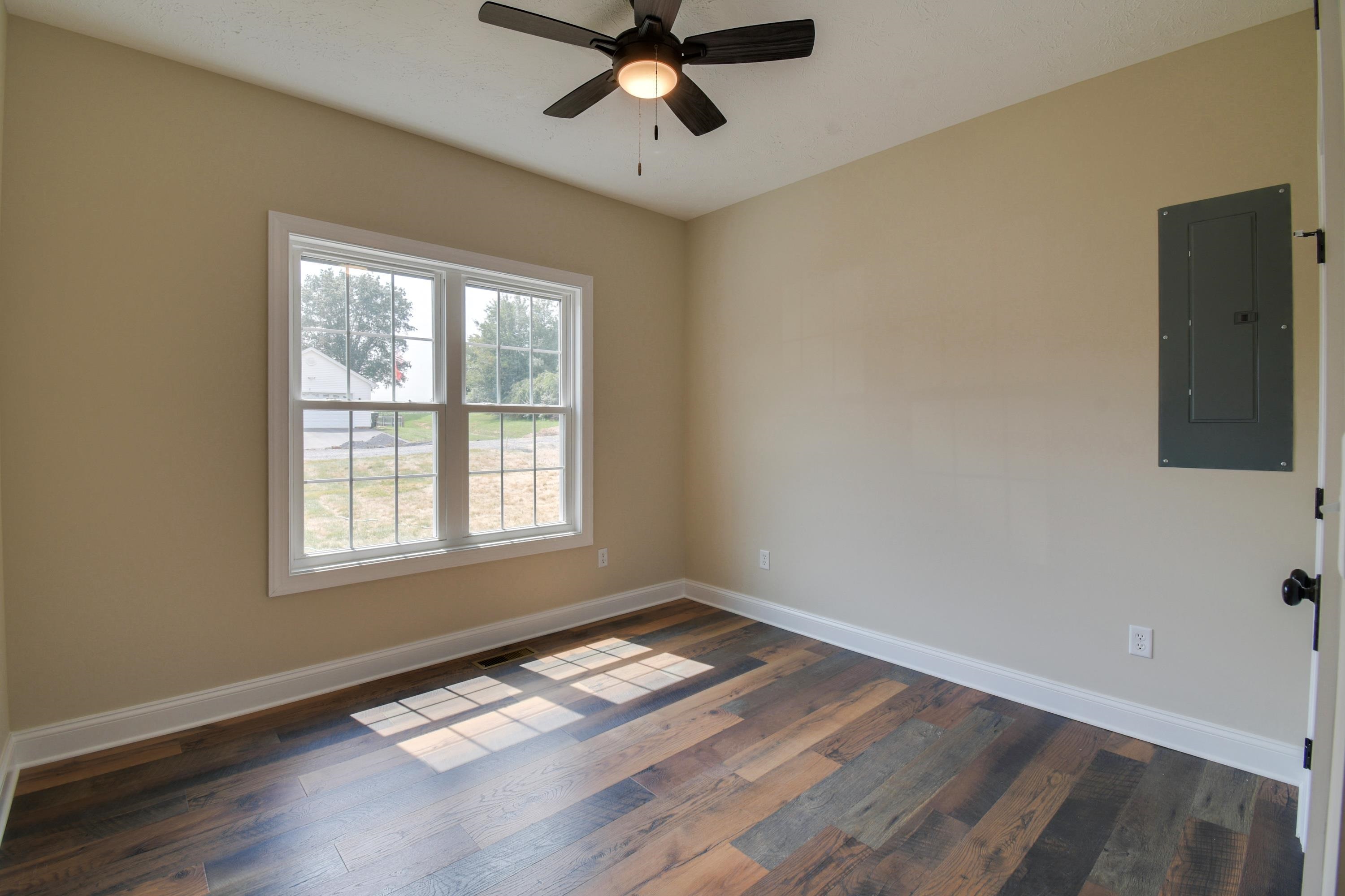 103 Fall Ridge Drive Stuarts Draft, VA 24477 - Photo 26 of 31 a view of empty room with wooden floor and fan