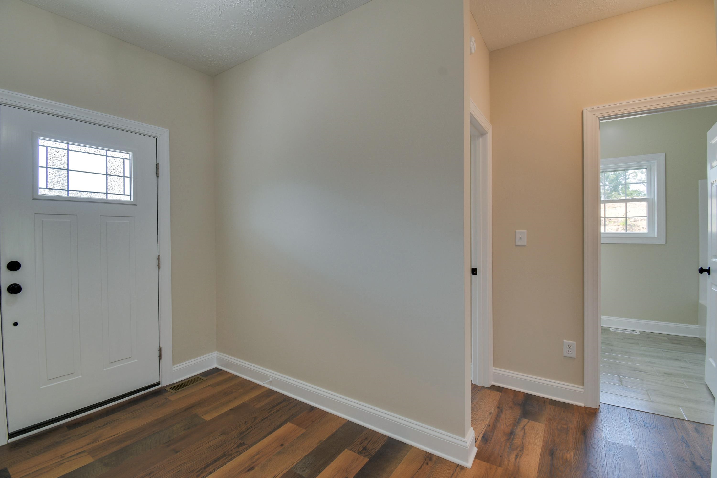 103 Fall Ridge Drive Stuarts Draft, VA 24477 - Photo 27 of 31 a view of an empty room with wooden floor and a window
