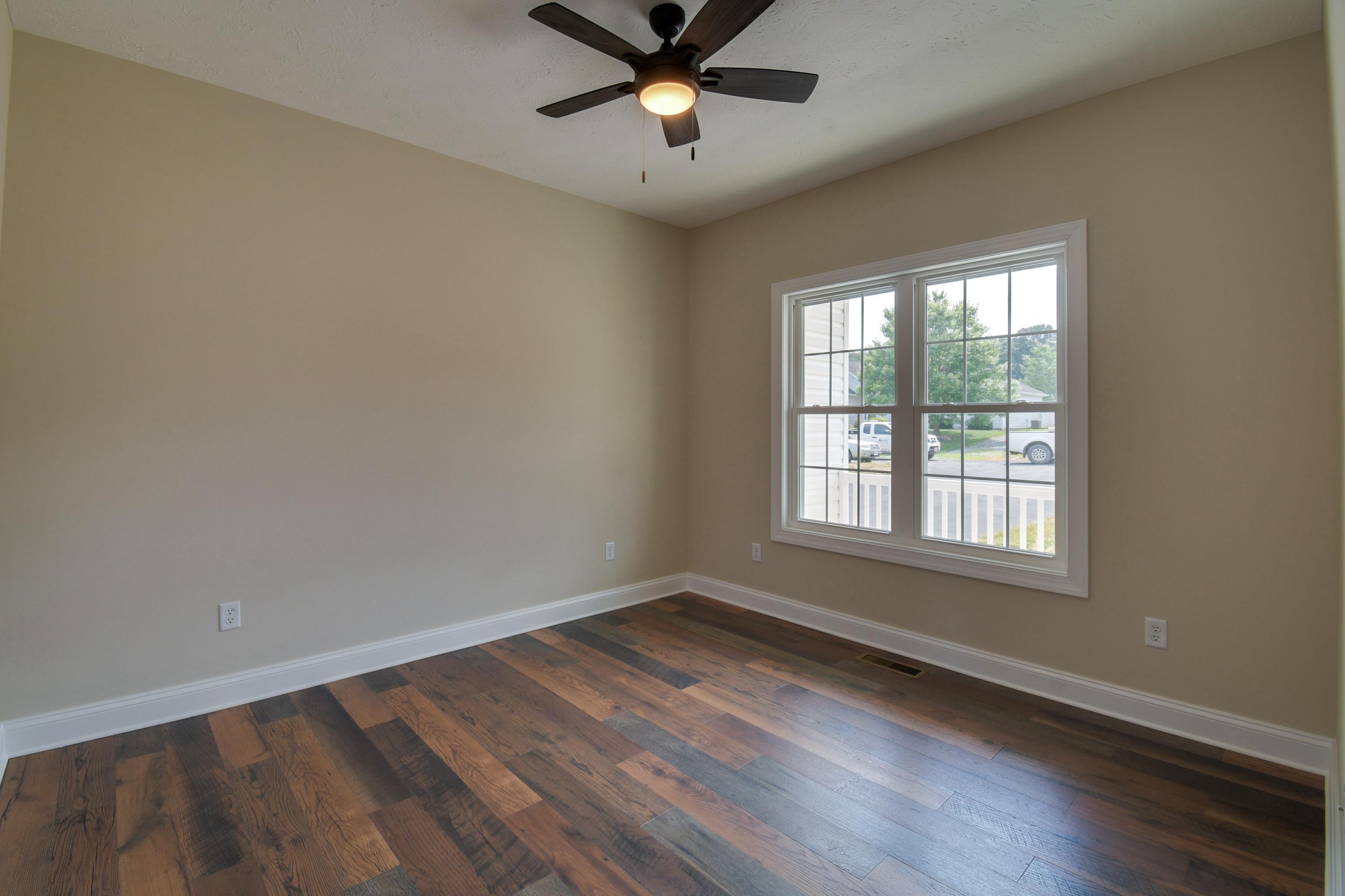 103 Fall Ridge Drive Stuarts Draft, VA 24477 - Photo 29 of 31 wooden floor in an empty room with a window
