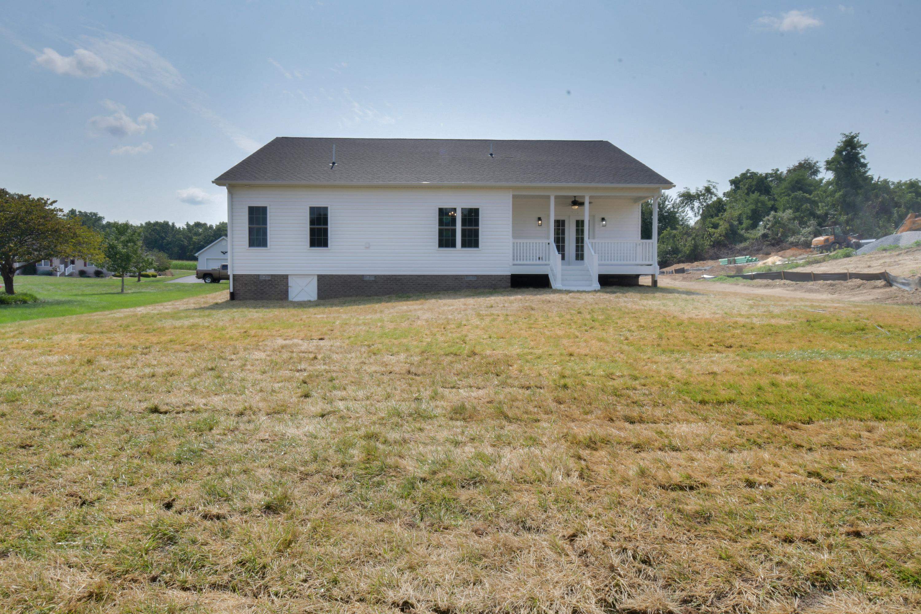 103 Fall Ridge Drive Stuarts Draft, VA 24477 - Photo 4 of 31 a front view of house with yard and trees around
