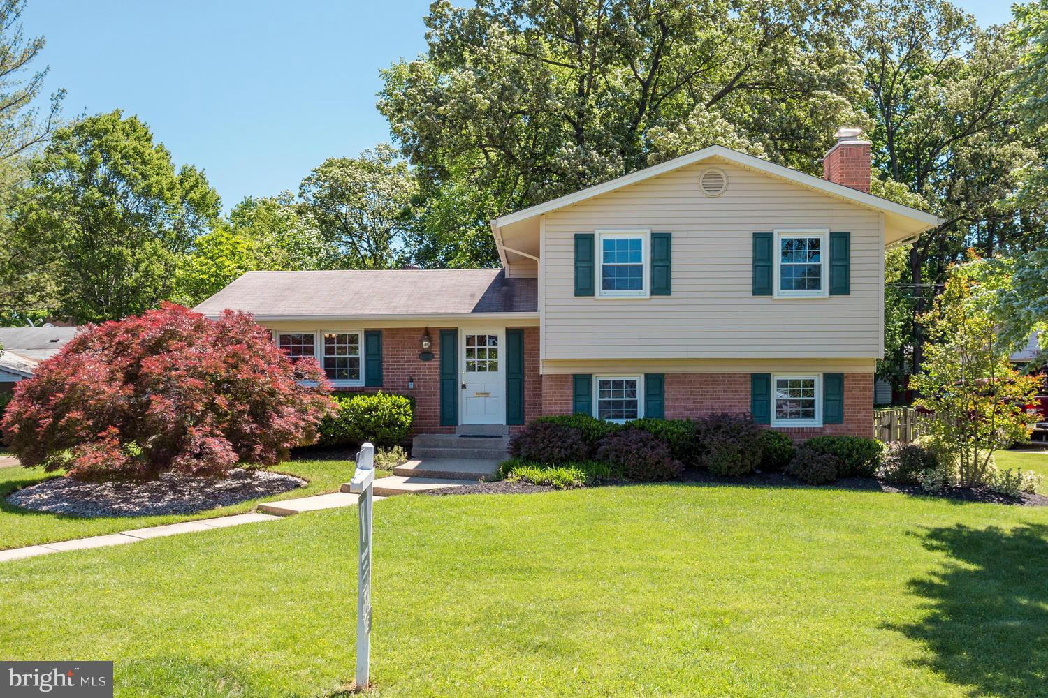 6003 Meriwether Lane Springfield, VA 22150 - Photo 1 of 30 a front view of a house with garden