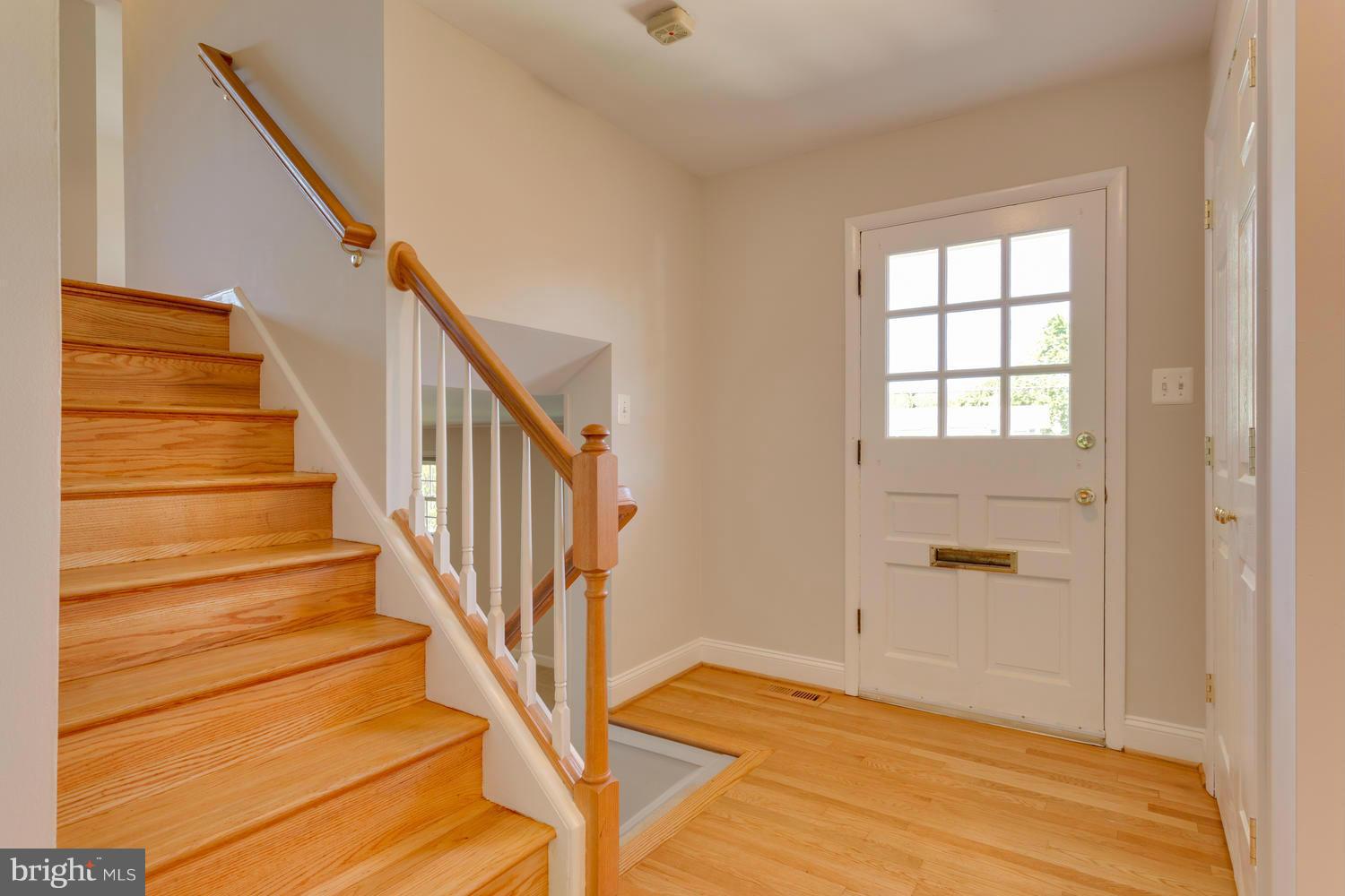 6003 Meriwether Lane Springfield, VA 22150 - Photo 2 of 30 a view of an entryway with wooden floor
