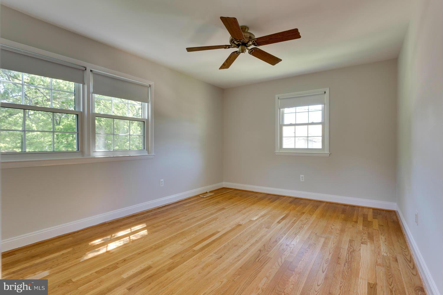 6003 Meriwether Lane Springfield, VA 22150 - Photo 12 of 30 a view of empty room with wooden floor and fan
