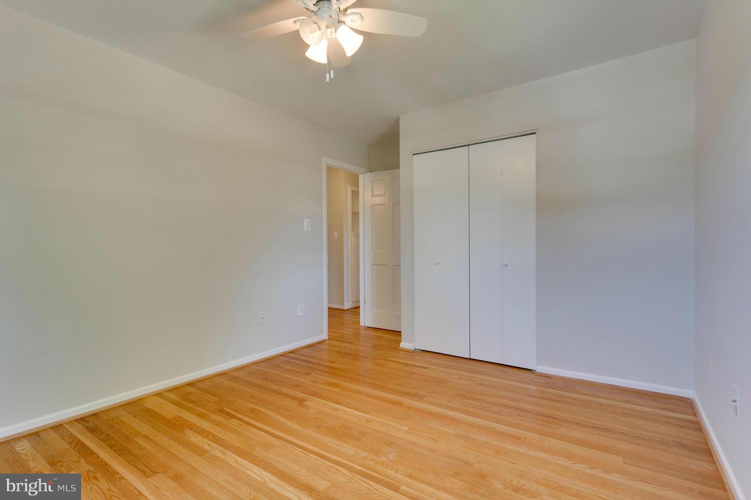 6003 Meriwether Lane Springfield, VA 22150 - Photo 17 of 30 a view of empty room with wooden floor