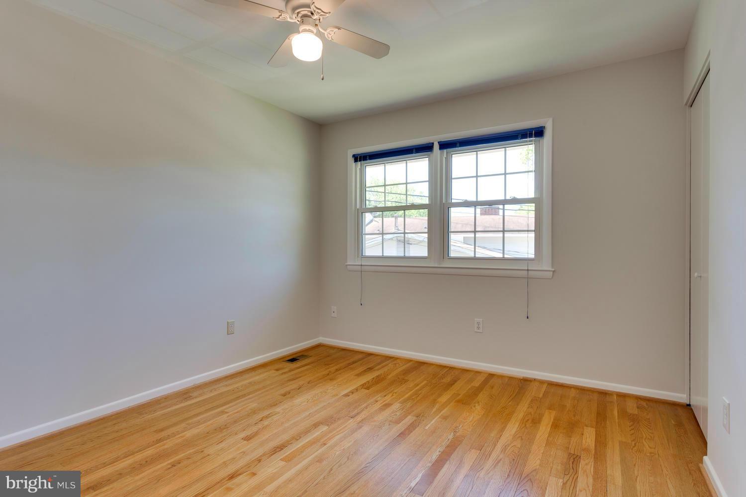 6003 Meriwether Lane Springfield, VA 22150 - Photo 18 of 30 wooden floor in an empty room with a window