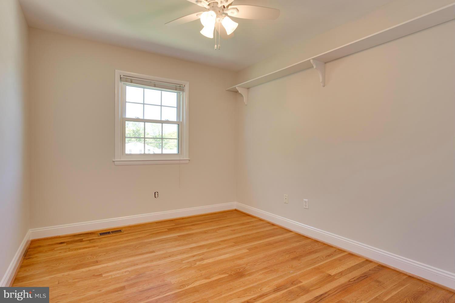 6003 Meriwether Lane Springfield, VA 22150 - Photo 20 of 30 wooden floor in an empty room with a window