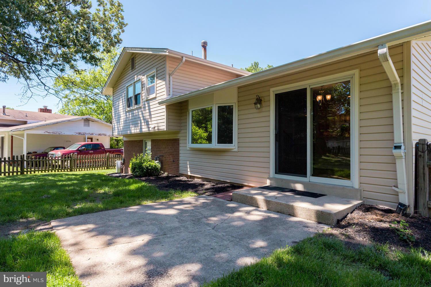 6003 Meriwether Lane Springfield, VA 22150 - Photo 29 of 30 a view of a house with a yard and sitting area