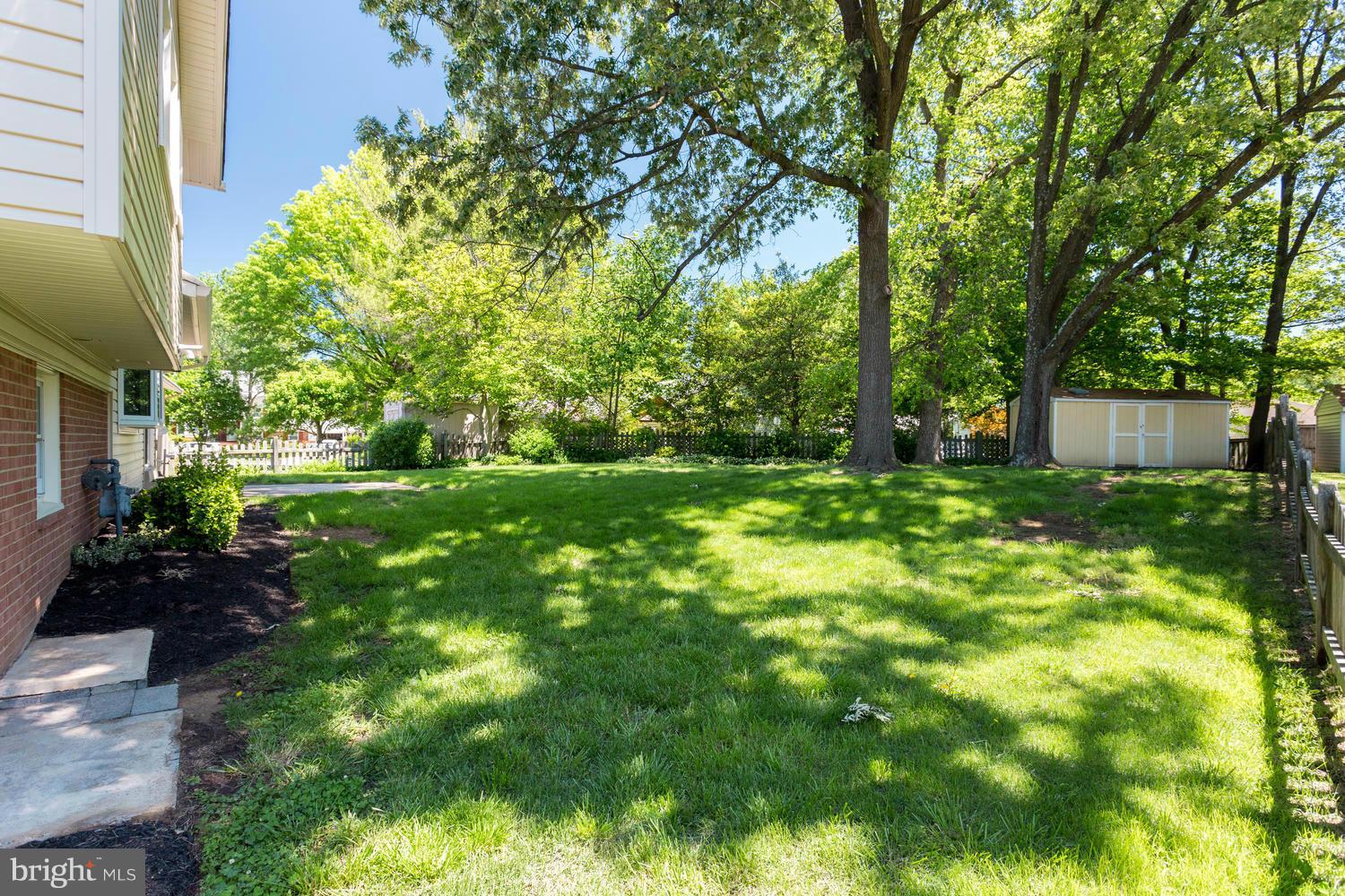 6003 Meriwether Lane Springfield, VA 22150 - Photo 30 of 30 a backyard of a house with lots of green space