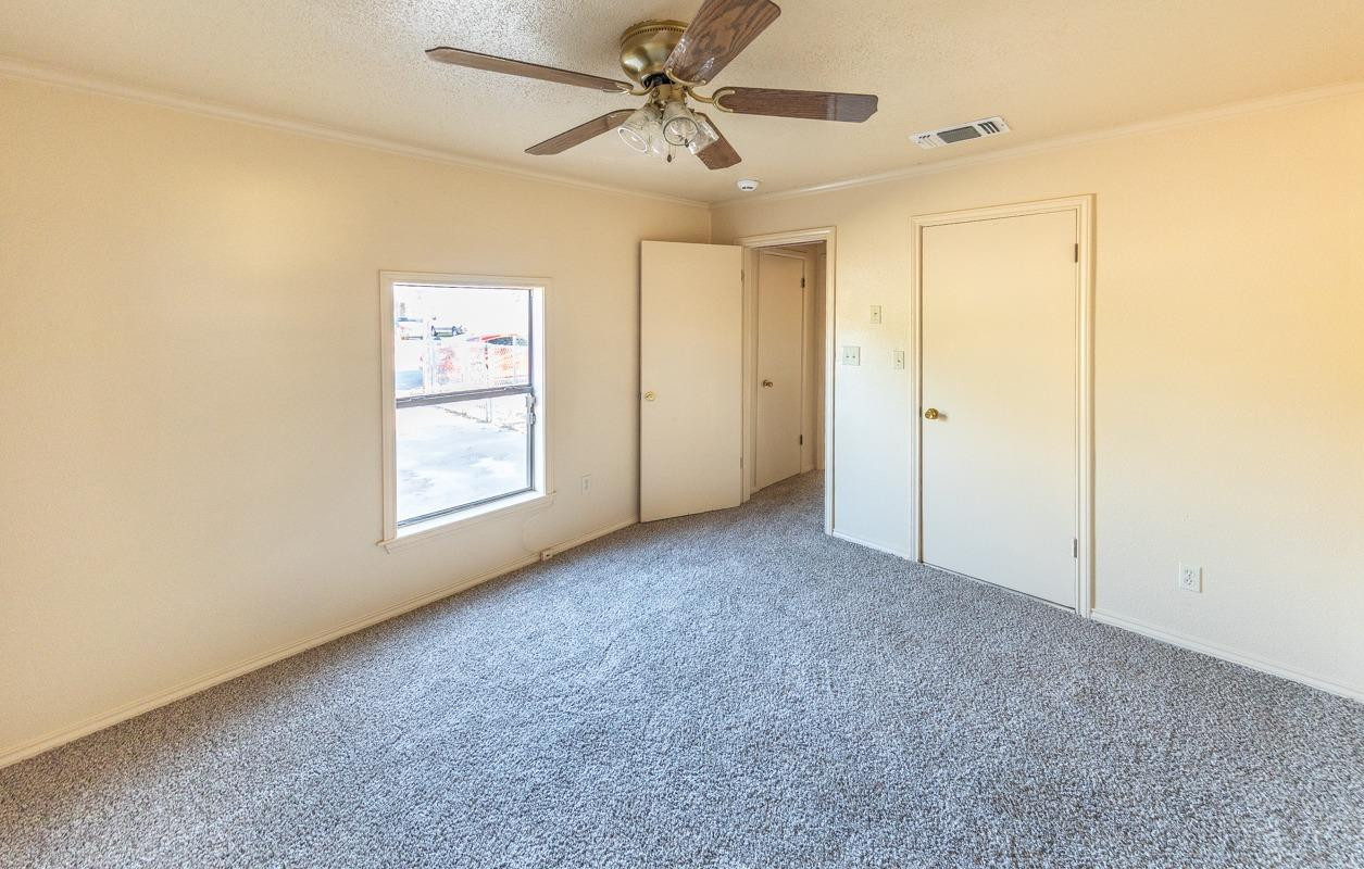 3007 Emory Street Lubbock, TX 79415 - Photo 12 of 17 a view of a livingroom with a ceiling fan and window