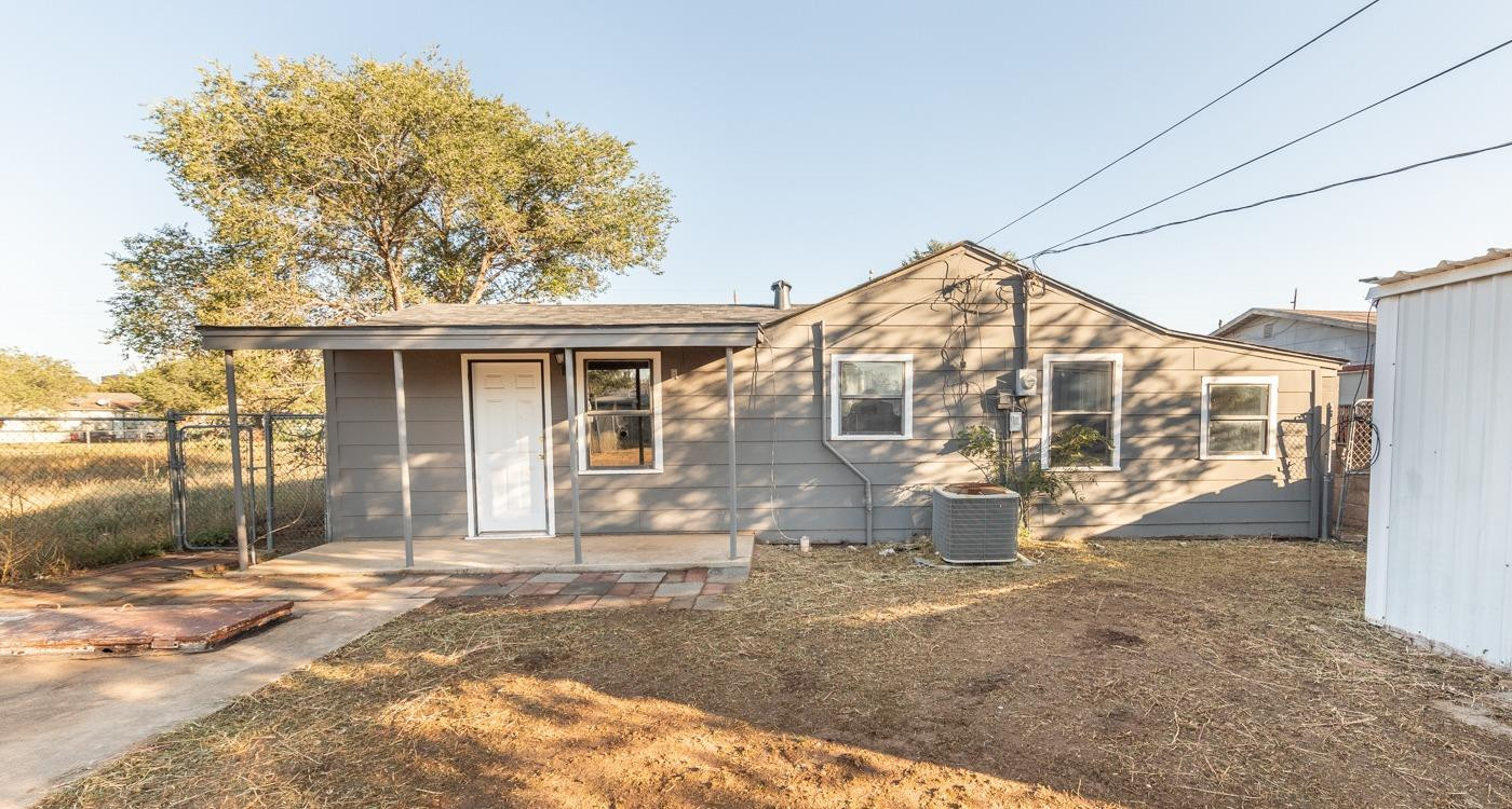3007 Emory Street Lubbock, TX 79415 - Photo 14 of 17 a front view of a house with a yard
