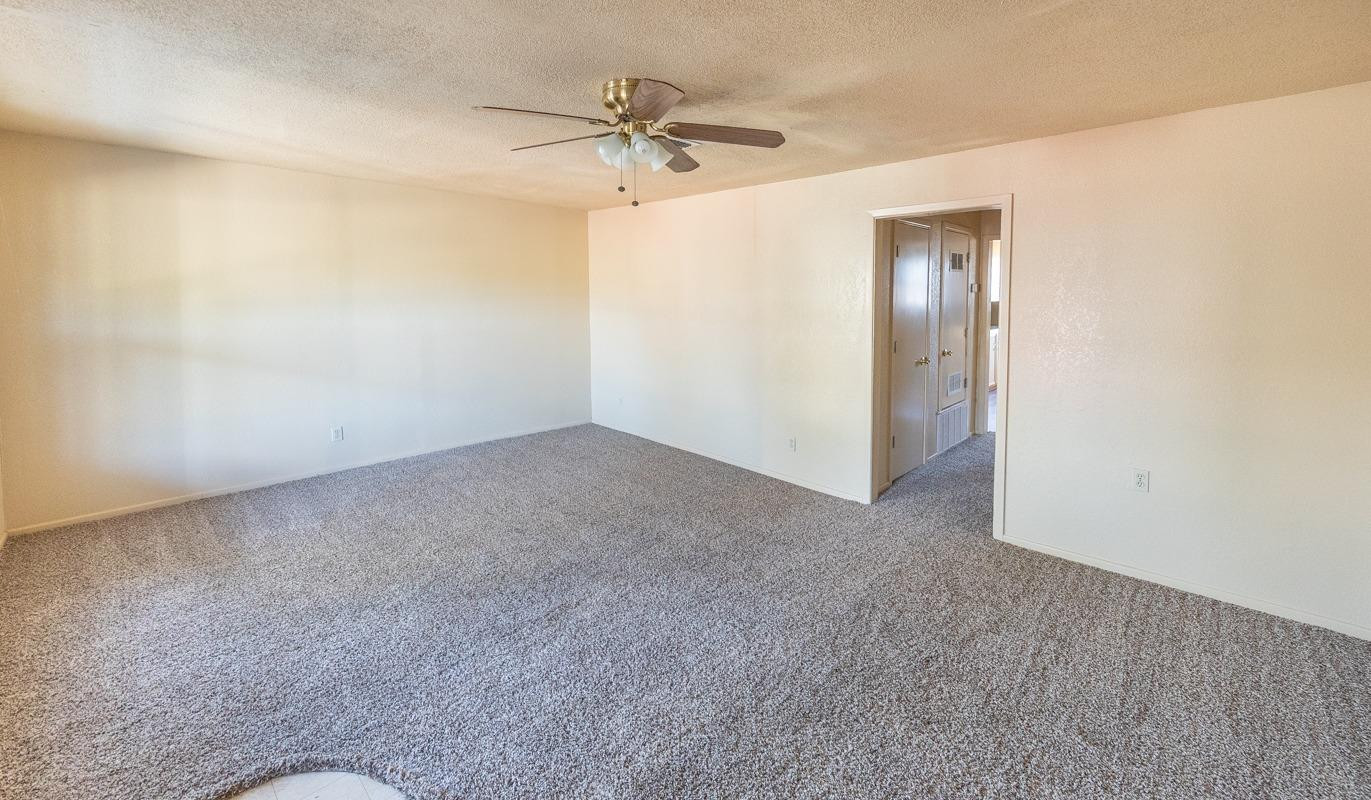 3007 Emory Street Lubbock, TX 79415 - Photo 2 of 17 a view of a room with a ceiling fan