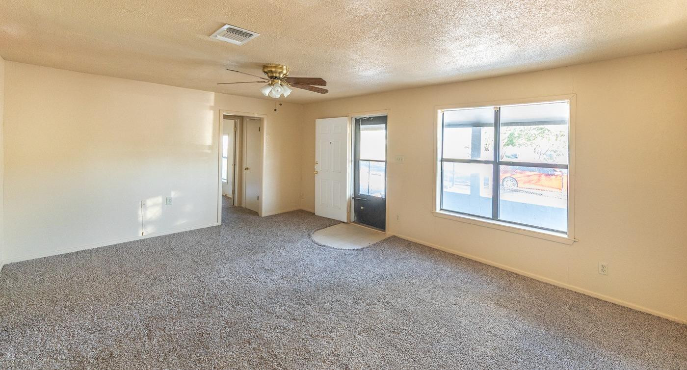 3007 Emory Street Lubbock, TX 79415 - Photo 3 of 17 a view of an empty room with a window