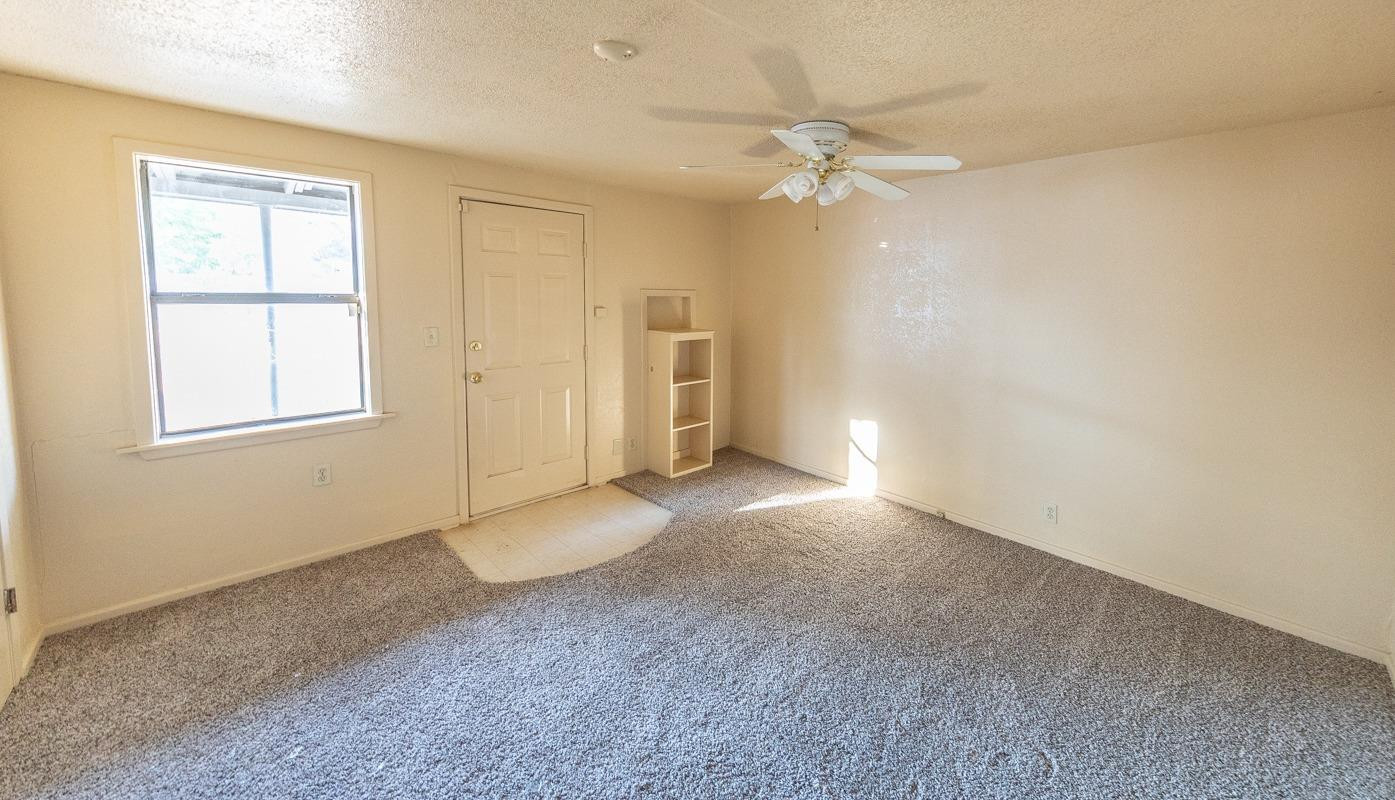 3007 Emory Street Lubbock, TX 79415 - Photo 9 of 17 a view of an empty room with a window