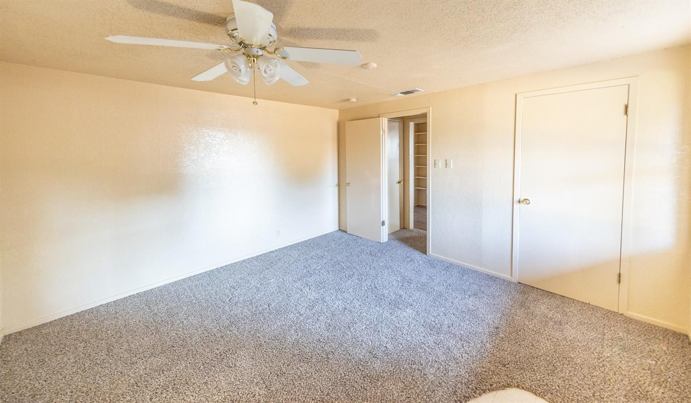 3007 Emory Street Lubbock, TX 79415 - Photo 10 of 17 a view of a livingroom with a ceiling fan
