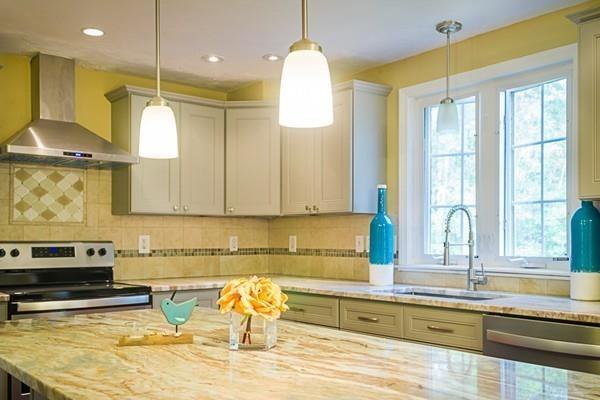 262 North Woodstock Road Southbridge, MA 01550 - Photo 7 of 25 a kitchen with stainless steel appliances granite countertop a sink a stove counter space and a window