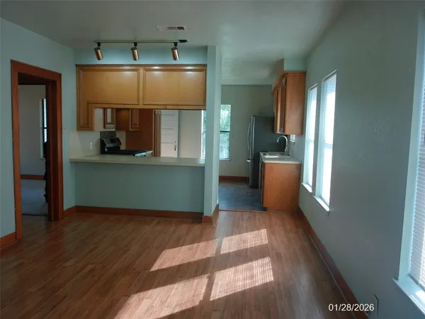 a stove top oven sitting inside of a kitchen