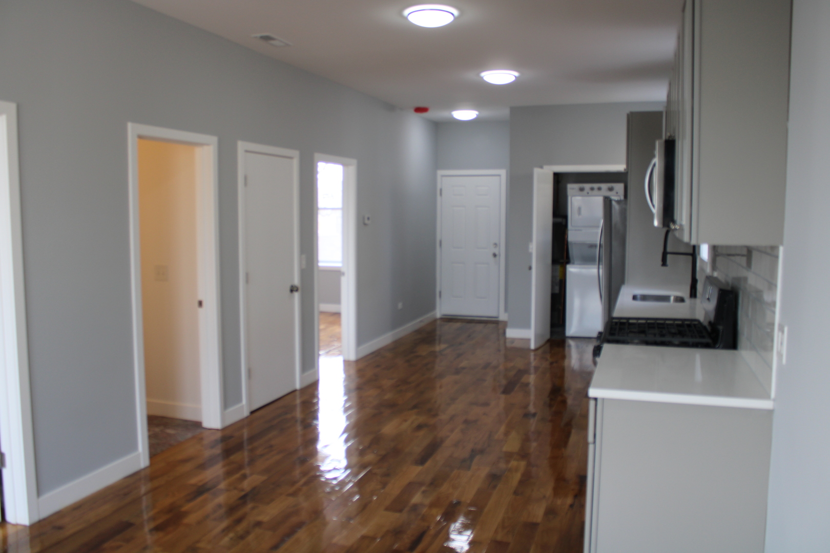 1533 South Ridgeway Avenue, Unit 1R Chicago, IL 60623 - Photo 3 of 7 a view of a kitchen with wooden floor