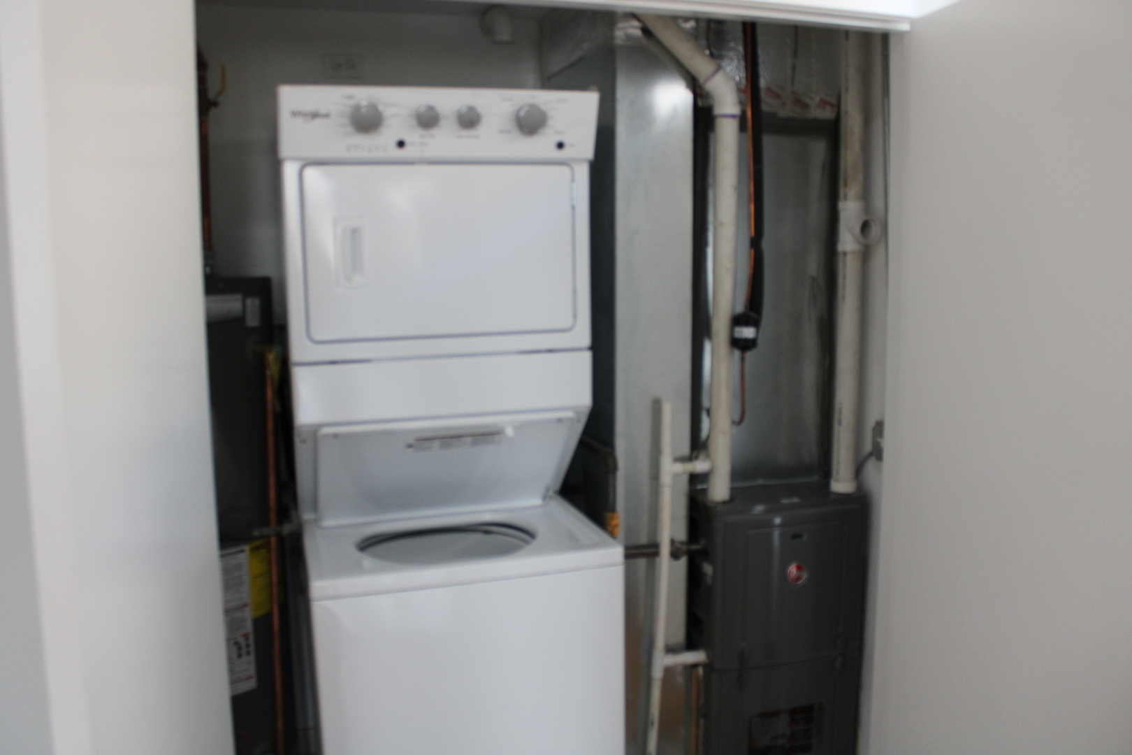 1533 South Ridgeway Avenue, Unit 1R Chicago, IL 60623 - Photo 7 of 7 a utility room with dryer and washer