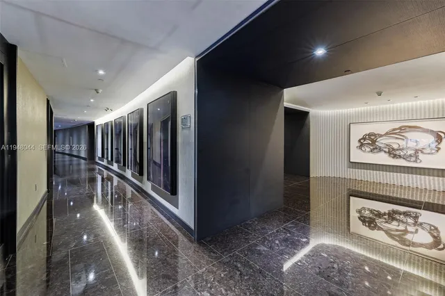 a hall with lots of frames and chairs