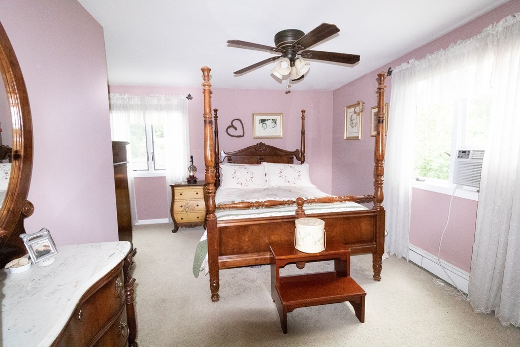 44 Flint Road Tyngsborough, MA 01879 - Photo 12 of 29 a living room with furniture and a chandelier