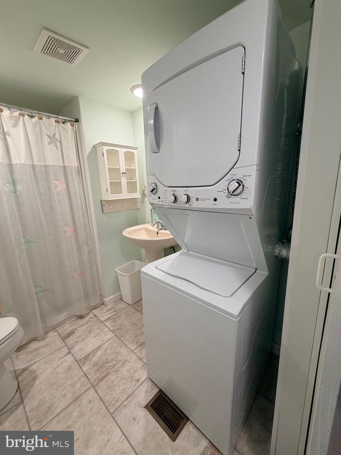38019 Rabbit Road Ocean View, DE 19970 - Photo 21 of 51 a bathroom with a sink a toilet and a mirror