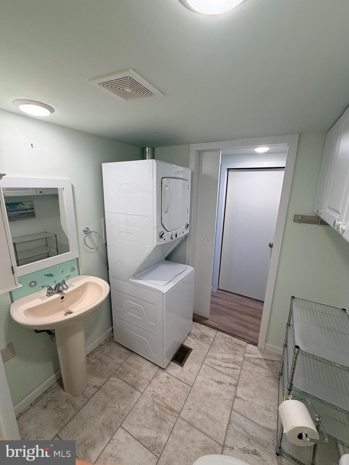 38019 Rabbit Road Ocean View, DE 19970 - Photo 22 of 51 a bathroom with a sink a toilet and mirror