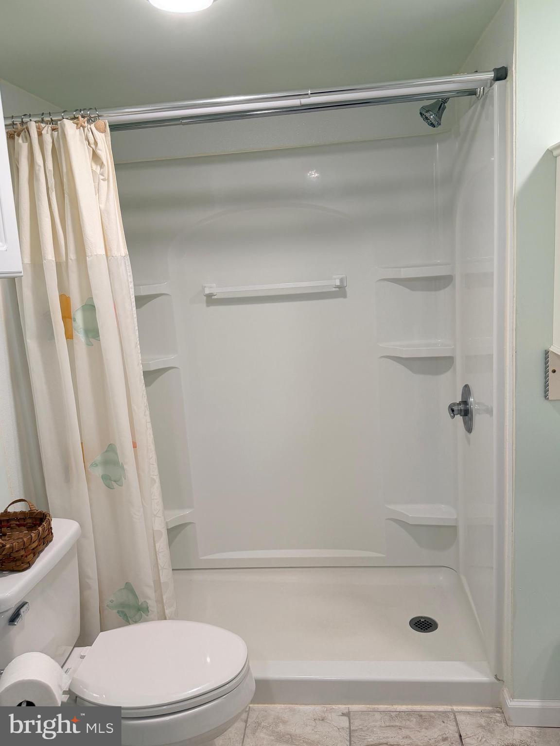 38019 Rabbit Road Ocean View, DE 19970 - Photo 24 of 51 a bathroom with a shower and a toilet