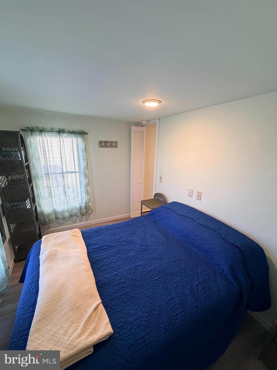 38019 Rabbit Road Ocean View, DE 19970 - Photo 32 of 51 a bed sitting in a spacious bedroom next to a window