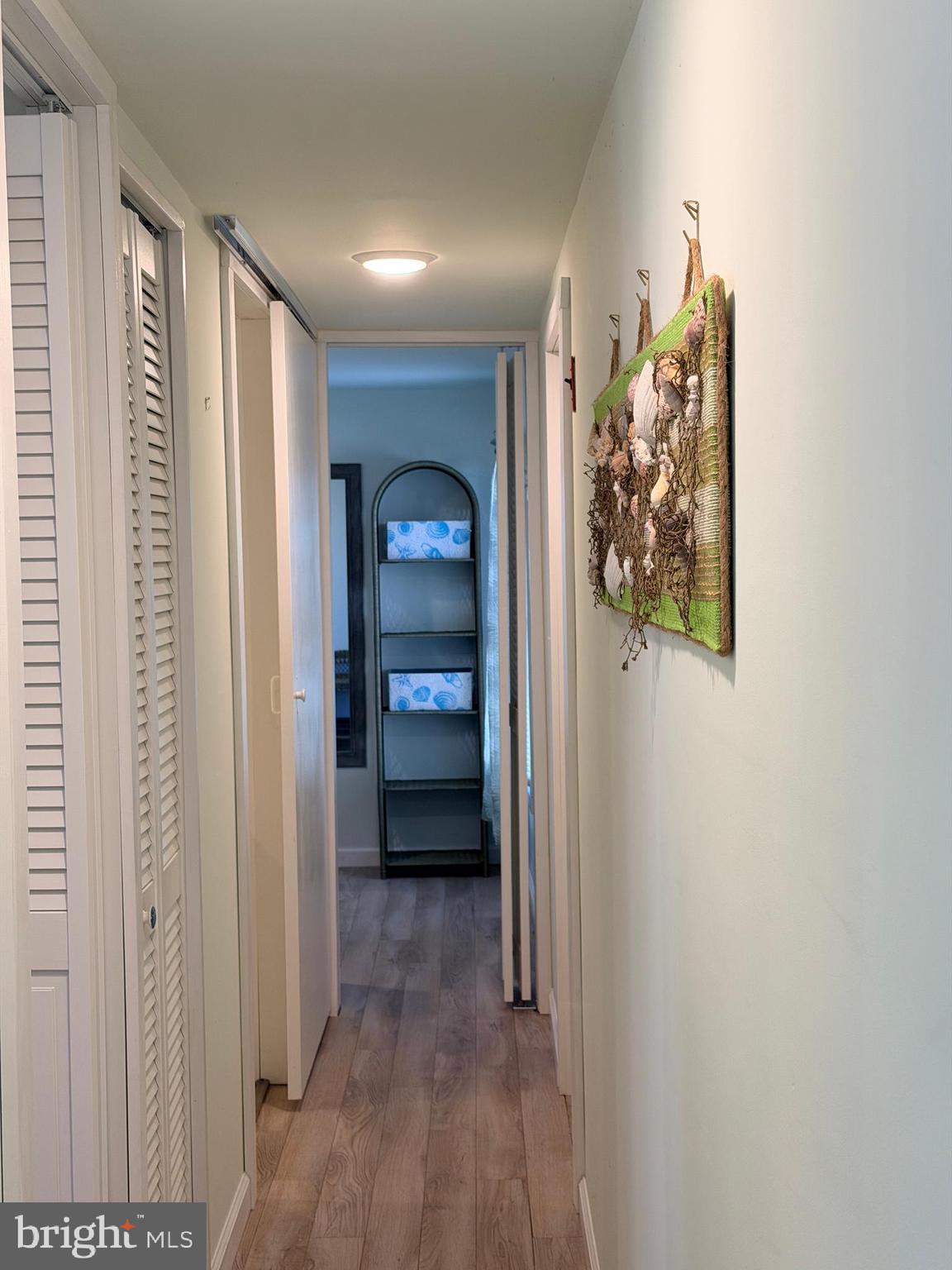 38019 Rabbit Road Ocean View, DE 19970 - Photo 34 of 51 a view of a hallway with wooden floor and closet